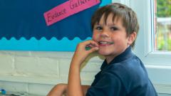 Young boy smiles for the camera