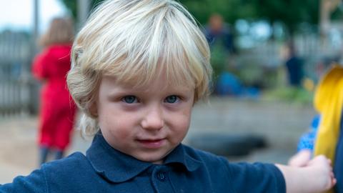 Young boy smiles for the camera