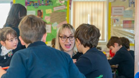 Teacher talking to her pupils